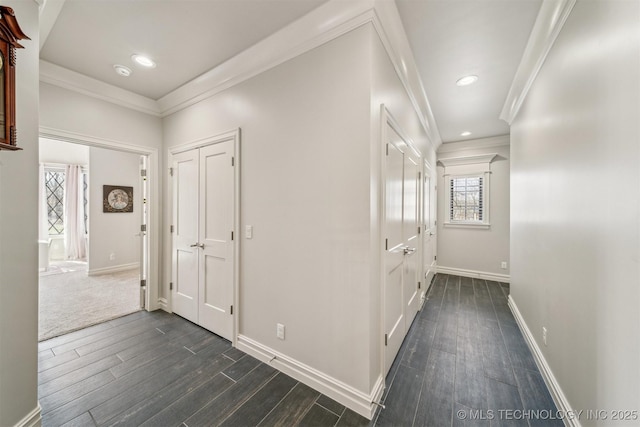 hallway with recessed lighting, baseboards, dark wood-type flooring, and crown molding