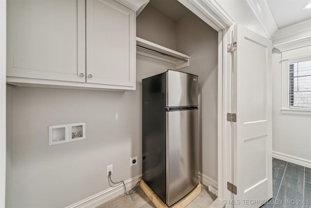 laundry area featuring tile patterned flooring, baseboards, washer hookup, cabinet space, and hookup for an electric dryer