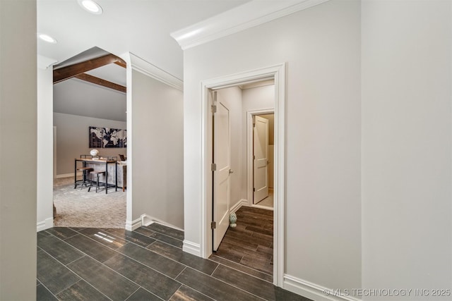 corridor featuring beam ceiling, recessed lighting, crown molding, baseboards, and wood tiled floor