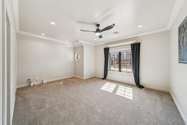 empty room with baseboards, carpet flooring, and crown molding