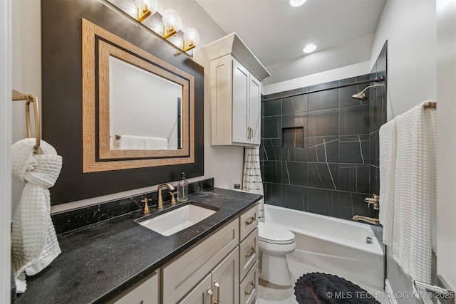 bathroom with vanity, toilet, and bathtub / shower combination