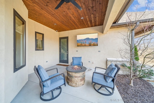 view of patio / terrace featuring an outdoor fire pit