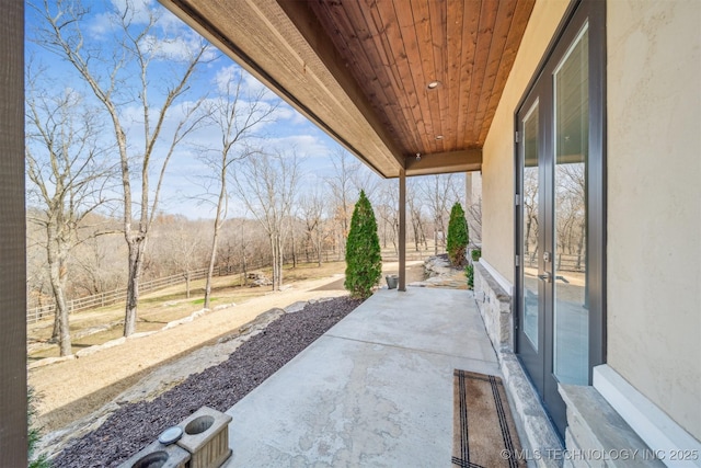 view of patio featuring fence