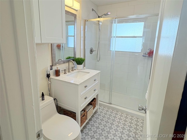 full bath featuring vanity, a shower stall, toilet, and tile patterned floors