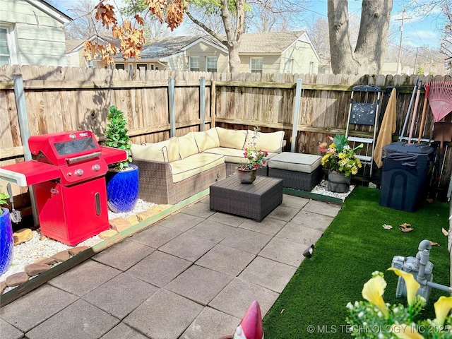 view of patio / terrace featuring grilling area, outdoor lounge area, and a fenced backyard