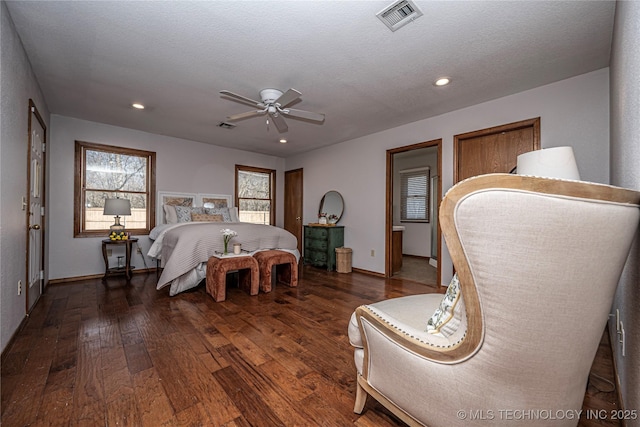 bedroom featuring recessed lighting, visible vents, wood-type flooring, and a textured ceiling