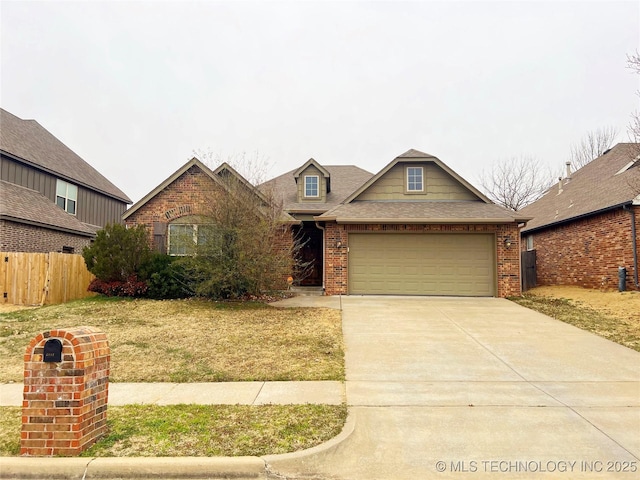 view of front of house featuring brick siding, an attached garage, a shingled roof, fence, and driveway