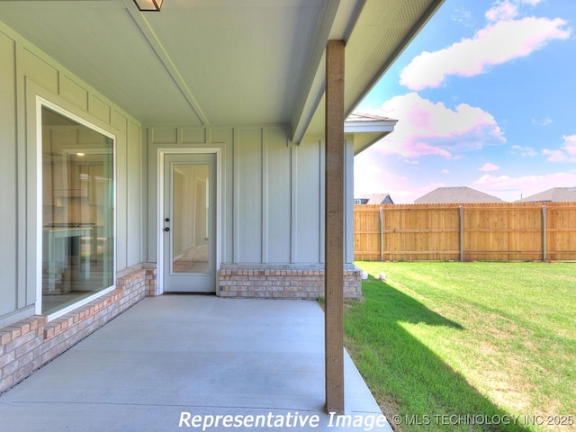 view of patio / terrace featuring fence