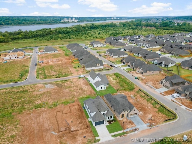 bird's eye view with a residential view and a water view