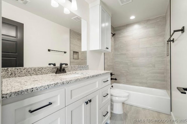 bathroom featuring tub / shower combination, visible vents, toilet, and vanity