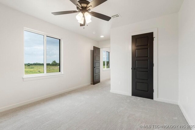 carpeted empty room with recessed lighting, visible vents, ceiling fan, and baseboards