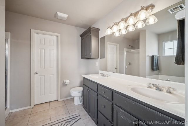 full bath featuring tile patterned floors, visible vents, a shower stall, and a sink