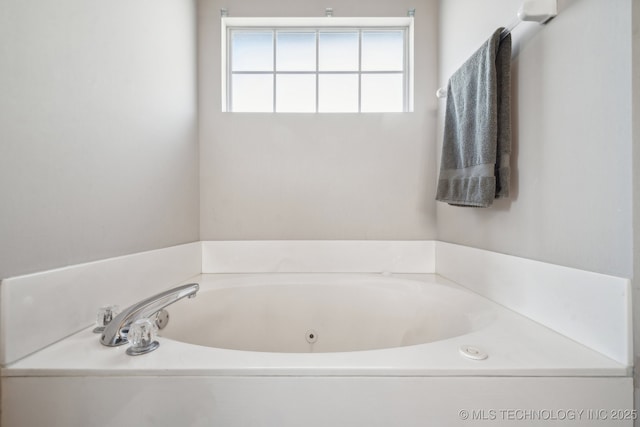 bathroom featuring a jetted tub