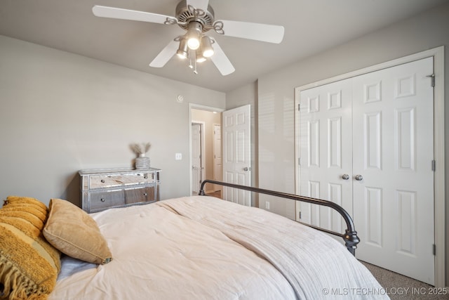 bedroom featuring a ceiling fan, a closet, and carpet floors