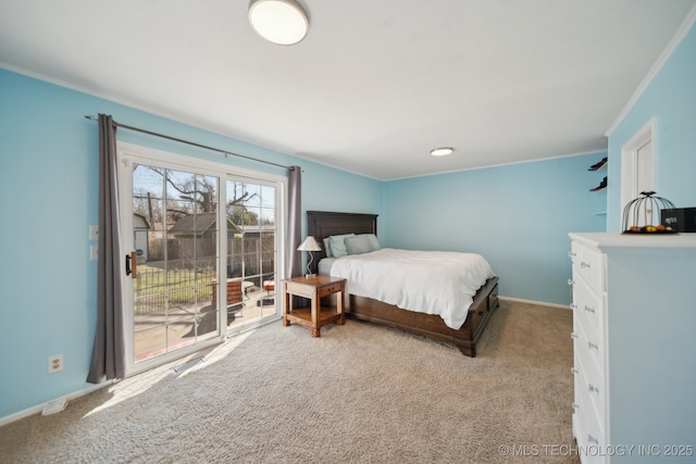 2503 S Pittsburg Ave, Tulsa, OK 74114 - carpeted bedroom with crown molding, visible vents, baseboards, and access to exterior