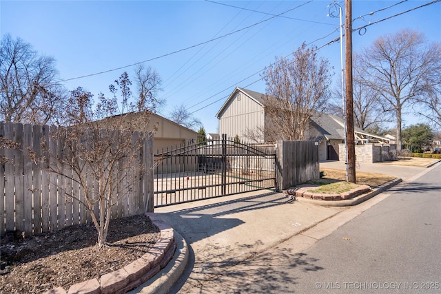 view of gate with fence