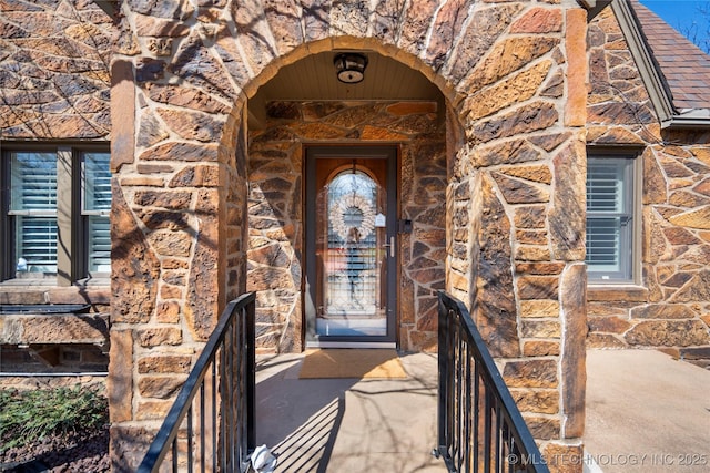 view of exterior entry with stone siding