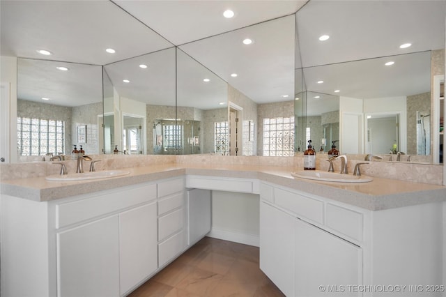 bathroom featuring recessed lighting, a stall shower, and vanity