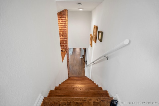 stairs with wood finished floors