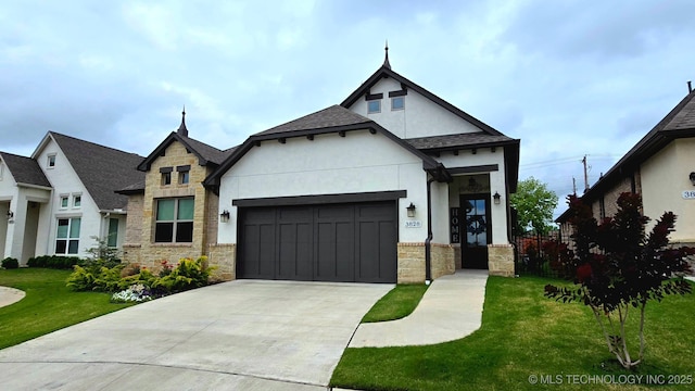 3828 W Orlando St, Broken Arrow, OK 74011 - view of front of home with stone siding, stucco siding, a garage, a front yard, and driveway