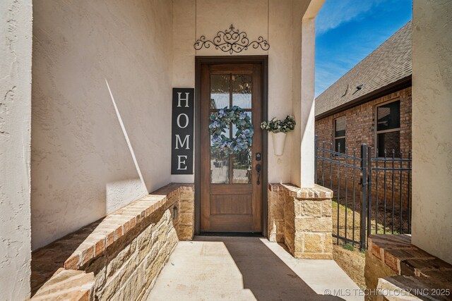 3828 W Orlando St, Broken Arrow, OK 74011 - view of exterior entry featuring stucco siding