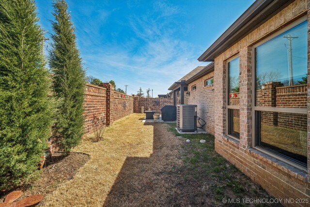 3828 W Orlando St, Broken Arrow, OK 74011 - fenced backyard featuring central AC
