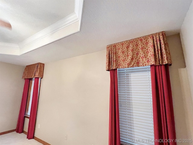 details with baseboards, a textured ceiling, and carpet flooring