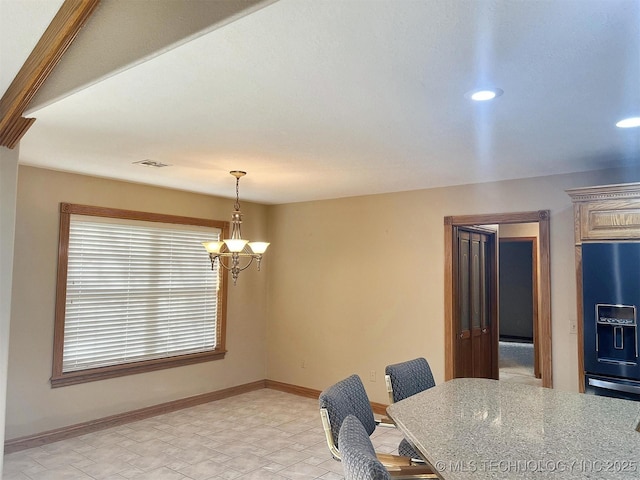 dining space with recessed lighting, baseboards, and a chandelier