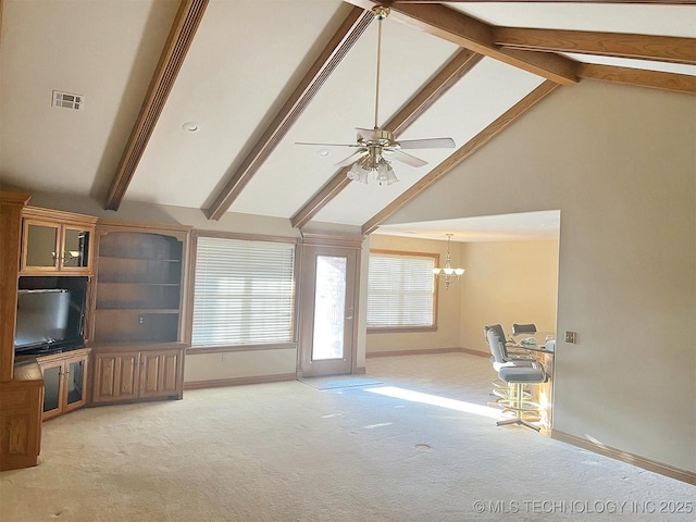 unfurnished living room with visible vents, beam ceiling, ceiling fan with notable chandelier, baseboards, and light colored carpet