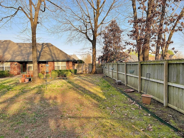 view of yard featuring a fenced backyard