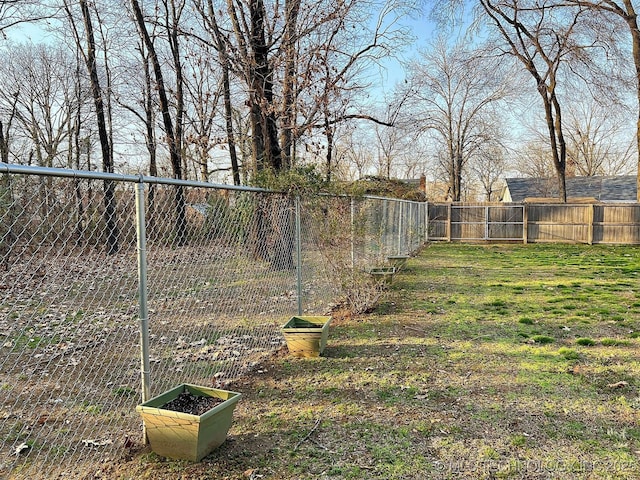 view of yard with a fenced backyard