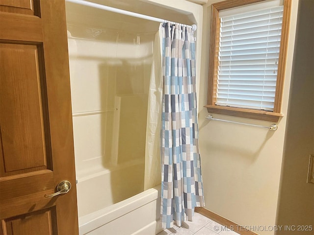 full bathroom featuring tile patterned flooring and shower / bath combination with curtain