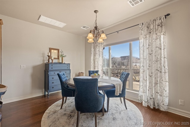 dining area with an inviting chandelier, dark wood-style floors, visible vents, and baseboards