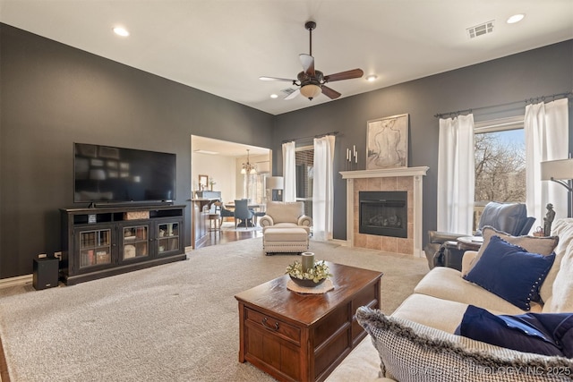 living room featuring visible vents, ceiling fan, carpet floors, recessed lighting, and a fireplace