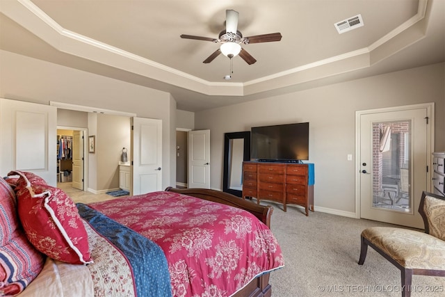 bedroom with baseboards, visible vents, carpet floors, a raised ceiling, and access to outside