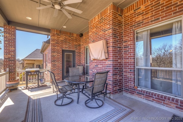 view of patio / terrace with area for grilling, outdoor dining area, and a ceiling fan