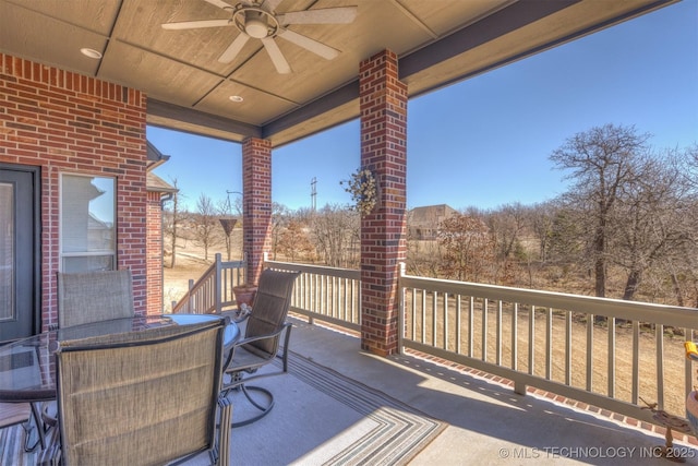 deck featuring outdoor dining space and ceiling fan