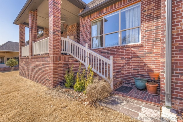 property entrance with brick siding