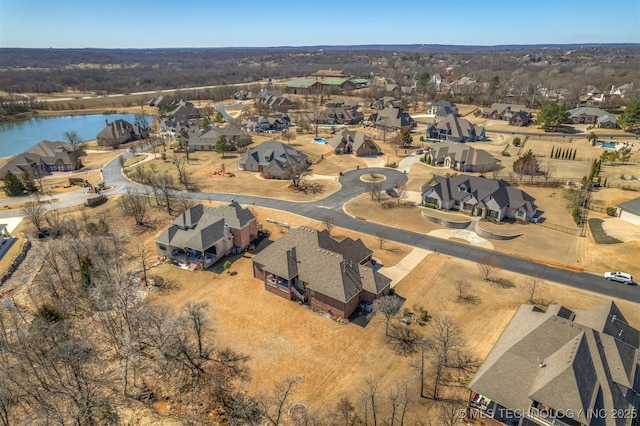 birds eye view of property featuring a residential view and a water view