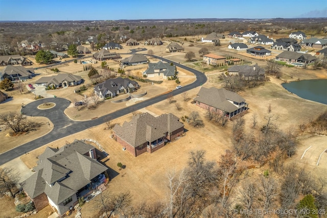 birds eye view of property with a residential view