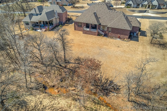 birds eye view of property with a residential view