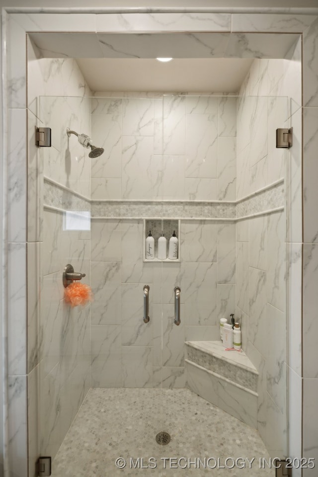 full bathroom featuring a shower stall