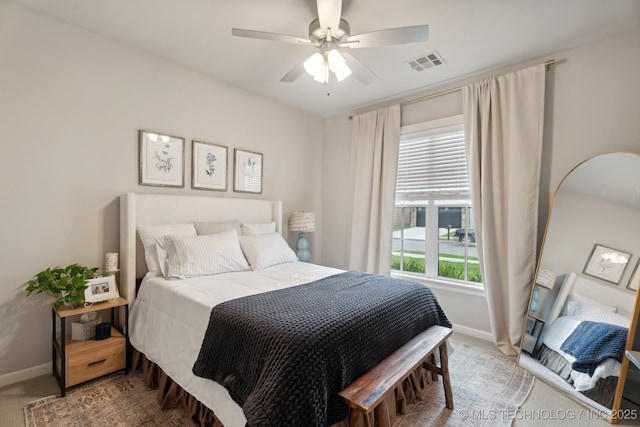 bedroom featuring carpet flooring, baseboards, visible vents, and ceiling fan