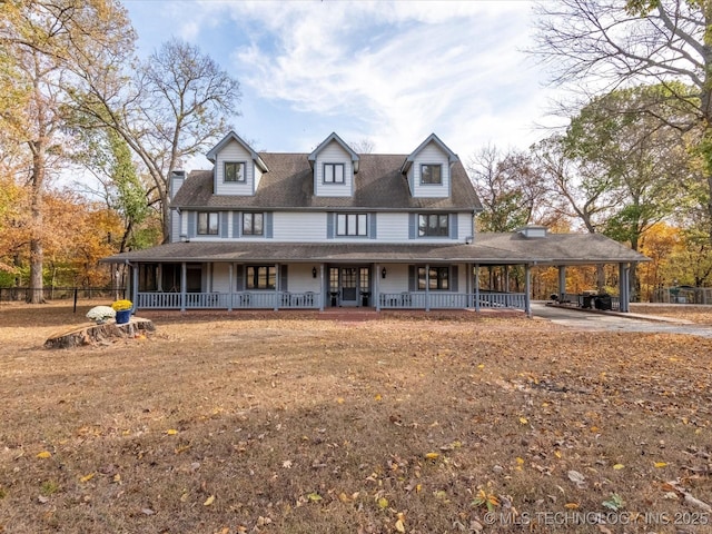 farmhouse inspired home with a carport and a porch