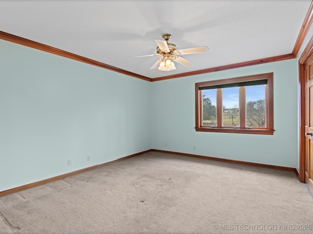 empty room featuring baseboards, light carpet, and ornamental molding