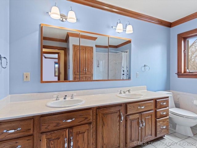 full bath featuring tile patterned floors, toilet, crown molding, and a sink