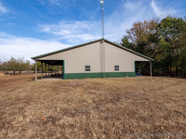 view of pole building with a lawn