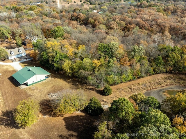 bird's eye view featuring a forest view