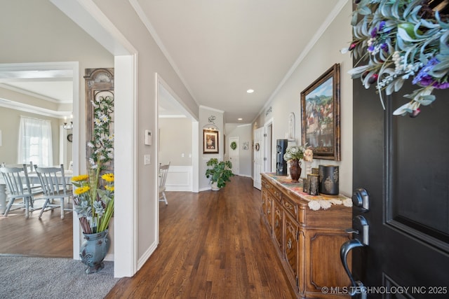 foyer with dark wood finished floors, recessed lighting, and crown molding