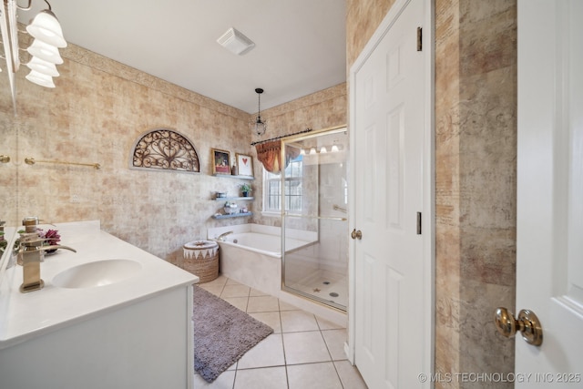 bathroom featuring a garden tub, a sink, a shower stall, tile patterned flooring, and double vanity